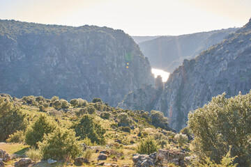 Natural landscape without people among rocky mountains, a river and vegetation. Arribes del Duero