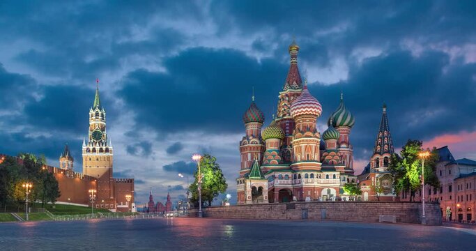 Moscow, Russia. View of Red Square with Saint Basil Cathedral and Spasskaya Tower at dusk (static image with animated sky)
