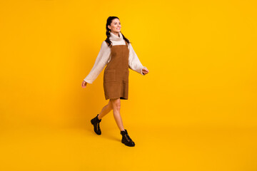 Fototapeta na wymiar Profile photo of pretty lady step look empty space wear brown overall pullover shoes isolated yellow color background