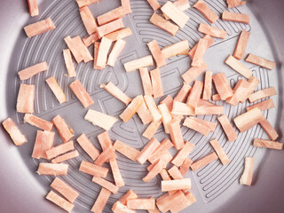 Bacon slices on frying pan. Diet concept