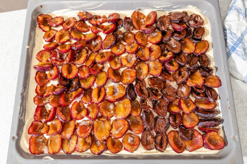 Baking plum cake in a kitchen
