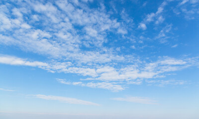 Blue sky with white altocumulus clouds on a daytime