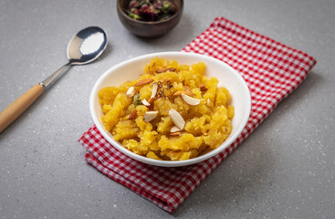 Moong Dal Halwa or Mung Daal Halva is an Indian dessert recipe, made with mung lentil, clarified butter and sugar, garnished with dry fruits