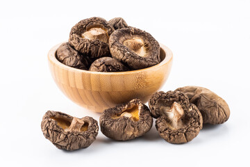 A lot of dried shiitake mushrooms in the wooden bowl