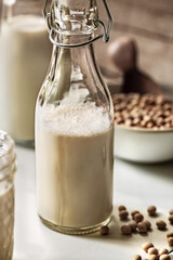 Soy milk in mason jar and bottles