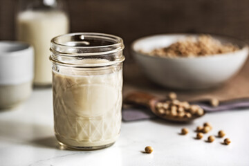 Soy milk in mason jar and bottles