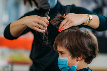 Boy With Protective Mask in Hair Salon