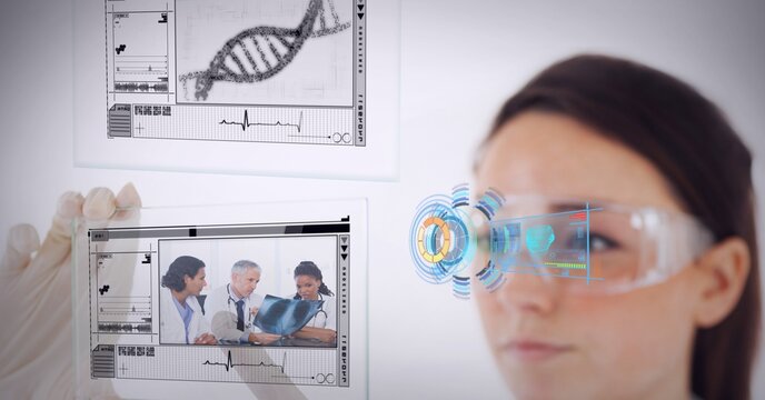 Medical data processing against female health worker wearing protective glasses