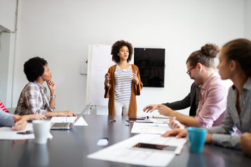 Group of people in a business meeting discussing ideas in office