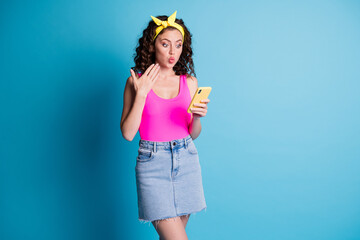 Photo of young attractive girl plump lips amazed shocked surprised browse news smartphone isolated over blue color background