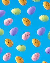 A pattern of colorful Easter eggs. Happy Easter. Colorful eggs on a blue background.