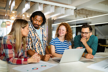 Business people having fun and chatting at workplace office