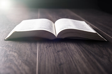 open Holy Bible on table