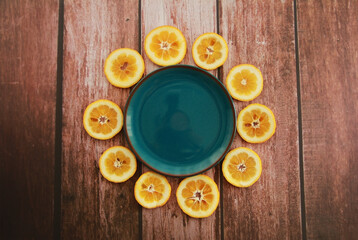 round orange slices and a blue decorative plate