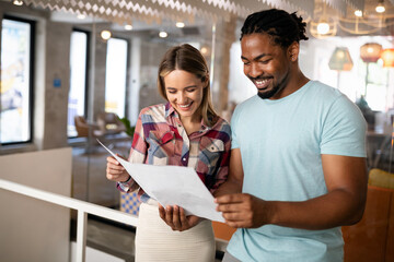 Business people having fun and chatting at workplace office