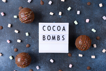 Cocoa bombs with marshmallows, chocolate that melts when hot milk is added for creating a trendy...