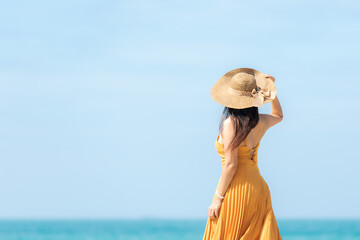 Summer vacations. Lifestyle woman relax and chill on beach background.  Asia happy young people...