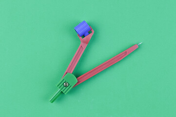 Math compass over green background