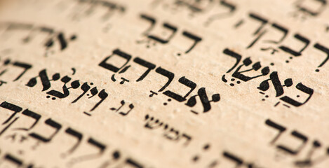 Closeup of hebrew word Abraham in Torah page. Selective focus. Banner. - obrazy, fototapety, plakaty