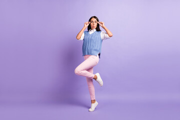 Fototapeta na wymiar Full length body size view of attractive amazed funky girl jumping touching specs wow isolated over purple violet color background