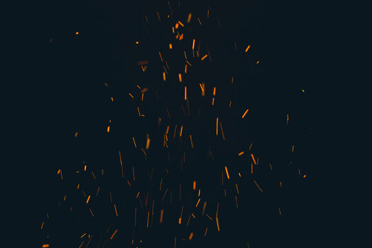 Big fire and silhouette of brazier on black background. Flame of fire in dark. Bonfire in barbecue at night. Dance of flame. Form of blaze