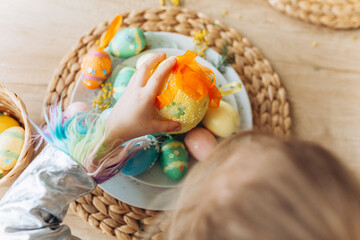 Kids hands with colorful easter eggs. Holidays, easter, traditions concept