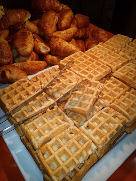 Breakfast waffles and serving tongs