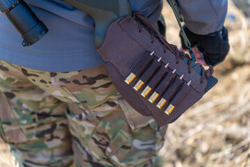 Shellholder on rifle stock. Bandolier with cartridges on a rifle close up