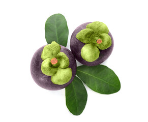 Delicious ripe mangosteens and green leaves on white background, top view