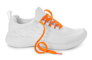 Stylish sneaker with orange shoelaces on white background