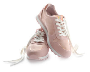 Stylish pink sneakers with shoelaces on white background