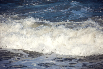 Sea waves and foam of Mediterranean sea with strong wind, Spain,