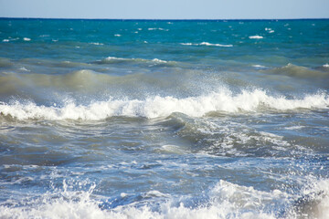 Sea waves and foam of Mediterranean sea with strong wind, Spain,