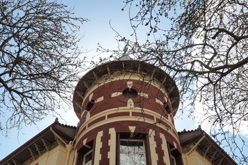 Beautiful public neoclassic tower building in Kifisia district on a blue cloudy sky, North Athens, Attica, Greece