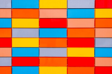 Multi-colored metal ventilated facade of the building. Background from the facade. Urban environment of the city