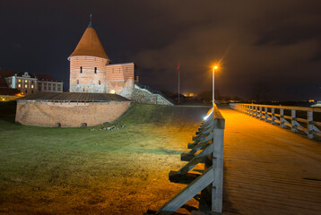 night view of the old town walls and castle tower in Europe 