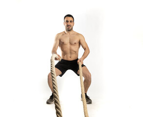 Fototapeta premium athlete man training with gym ropes on white background