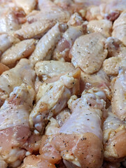 raw chicken wings marinated ad ready for cooking