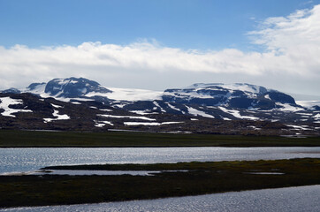 Views from the train window. Mountain tundra of Central Norway. Railway travel in Norway.The Bergen...