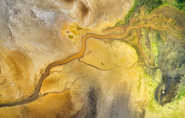 Dry lake or swamp in the process of drought and lack of rain or moisture, a global natural disaster - aerial drone view
