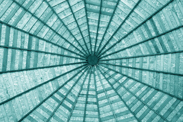 Wooden roof from bottom in cyan tone.