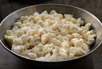 Cauliflower pieces in a steel bowl