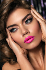 Obraz premium Close up portrait of young beautiful model with clean healthy skin and possible make-up. emphasis on lips, lipstick. Classic makeup with arrows on the eyes. Hollywood diva.