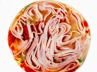 Detail of sliced ham in aspic, one circle, nice structure and texture.