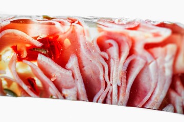 Detail of sliced ham in aspic, nicely visible structure of stacked ham,