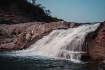 Fototapeta na wymiar Zanzari Waterfall on vatrak river in Gujarat 