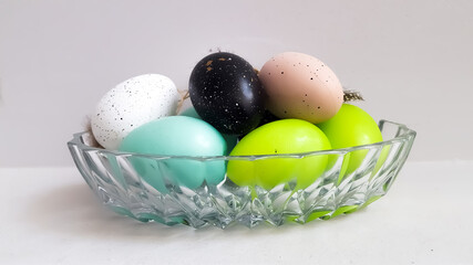 Colored Easter eggs in ac crispy plate. High quality photo