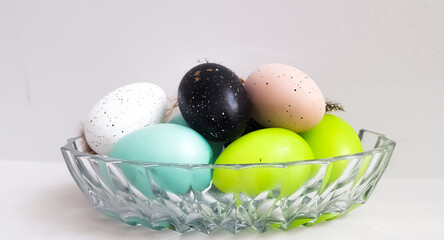 Colored Easter eggs in ac crispy plate. High quality photo