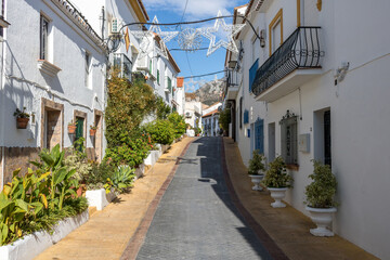 Fototapeta na wymiar Street on the beautiful white city of Benalmadena Pueblo (The Old Village) in Malaga, Spain