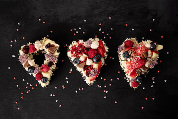 Heart shaped layered cake with fruit. Romantic present. Sweet Valentine. Bakery or confectionery...